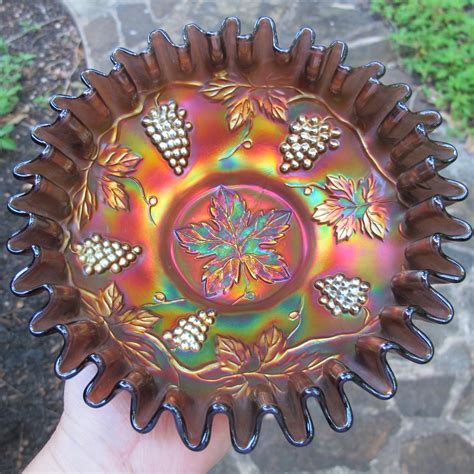 com regularly sell pieces in the range of $35 to $85. . Carnival glass bowl grape pattern